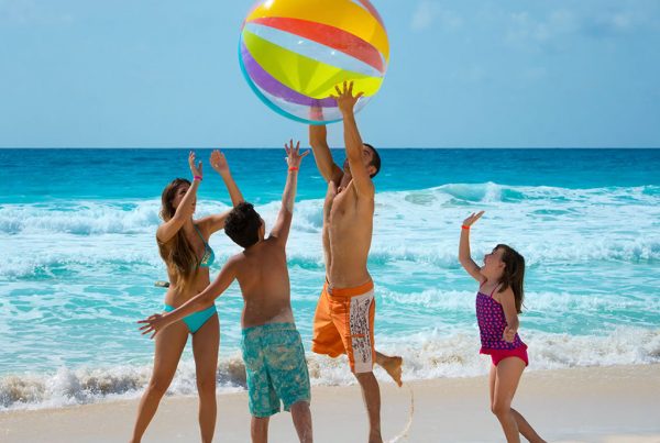 family playing on the beaches of the Riviera Maya